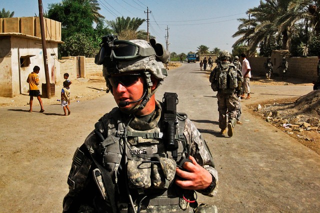 TAJI, Iraq-Staff Sgt. Ty Vincent, from Hackberry, La., a squad leader in Company F, 3rd Battalion, 227th Aviation Regiment, 1st Cavalry Brigade, 1st Cavalry Division, Multi-National Division - Baghdad, watches over his Soldiers as they conduct a...