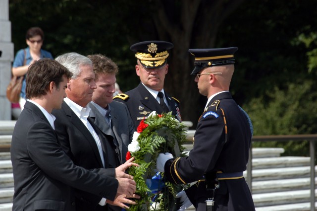 Members of the Hendrick Motorsports team, Jeff Gordon and Dale Earnhardt Jr., along with Chairman and Chief Executive Officer Rick Hendrick, escorted by Brig. Gen. Karl Horst, commander of the Joint Force Headquarters, National Capital Region and...
