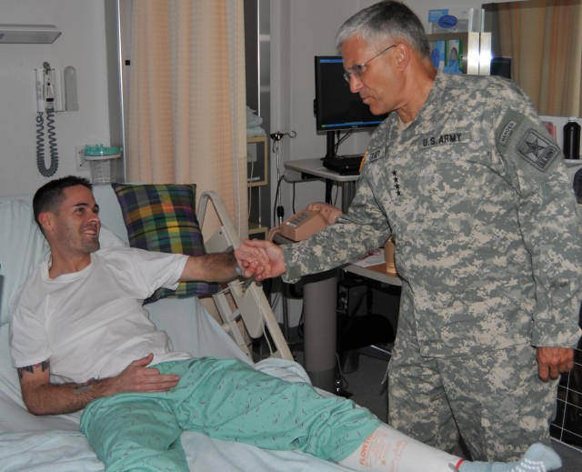 Petty Officer 2nd Class Christian L. Dullock-Binoche meets Chief of Staff of the Army Gen. George W. Casey Jr.