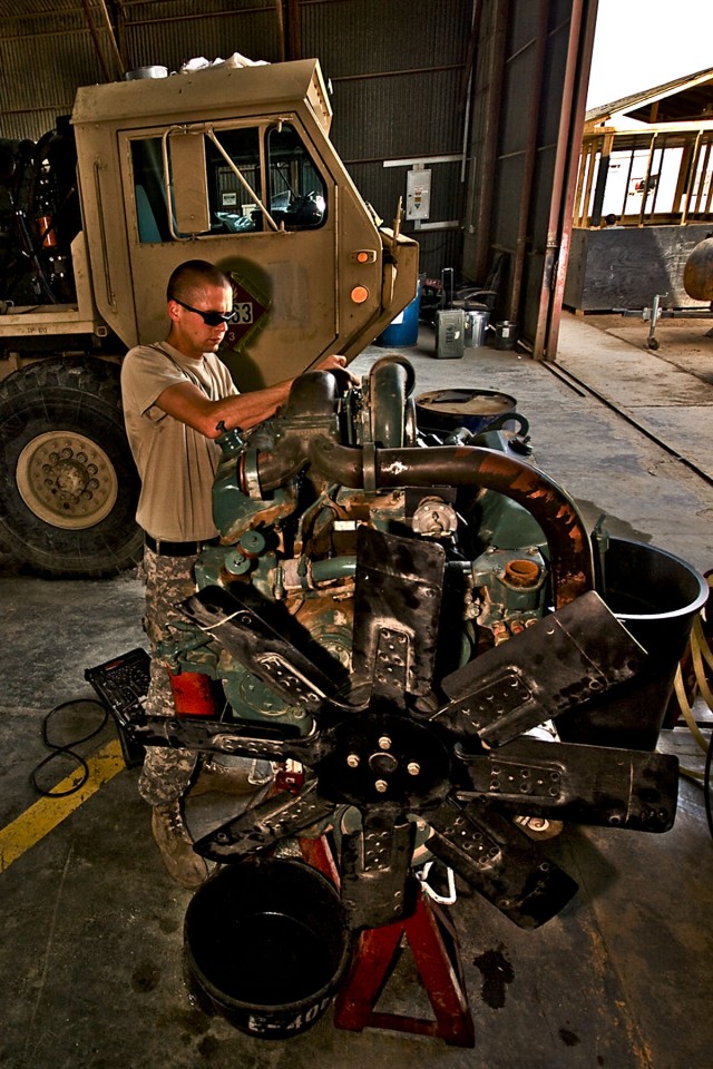 CAMP TAJI, Iraq-To ensure the injectors are adjusted correctly on a new engine, Spc. Lee Benjamin, from Batson, Texas, a light wheeled vehicle mechanic in Company E, 4th Battalion, 227th Aviation Regiment, 1st Air Cavalry Brigade, 1st Cavalry...
