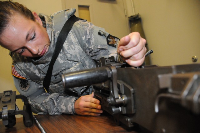 Sgt.  Haskins dissassembles a .50 caliber