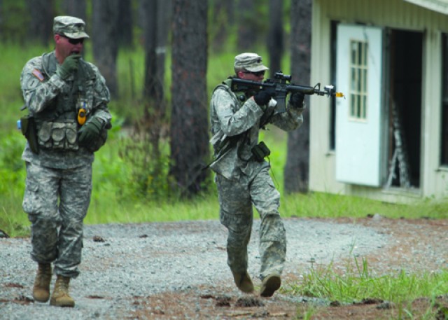 Spc. Jacob Southern, 5th Battalion, 25th Artillery Regiment, 4th Brigade Combat Team, 10th Mountain Division, demonstrates how to administer first aid for a sucking chest wound dur