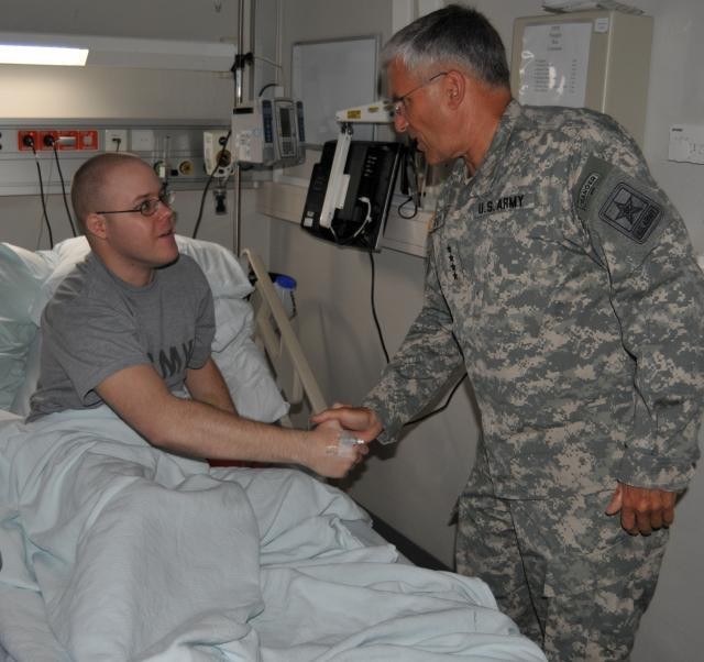 Spc. Ryan G. Christian meets Chief of Staff of the Army Gen. George W. Casey Jr. at Landstuhl Regional Medical Center, Germany, Sept. 25. 