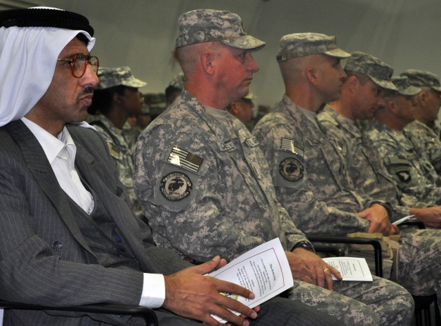 Muhammad Is- mail Ahmad Ramah (left), medical doctor and friend of Q-West leadership, observes the 16th Sustainment Brigade transfer of authority to 15th SB ceremony at the Morale, Welfare and Recreation building here, Oct. 5. (U.S. Army photo by...