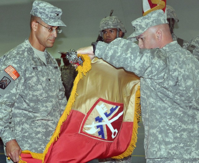 Col. Martin Pitts, 16th Sustainment Brigade commander and Command Sgt. Maj. James Spencer, 16th SB senior noncommissioned officer, case their unit's colors at transfer of authority ceremony which officially marks the end of their 15-month tour in...