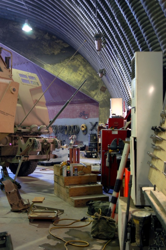 Formerly an Iraqi Air Force hanger, the maintenance shop of C Company, 2nd Battalion, 198th Combined Arms, Mississippi Army National Guard, out of Oxford, Miss., shows the organized clutter of heavy use Sept. 30. Because of busy motor shops such...
