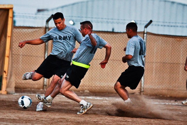 CAMP TAJI, Iraq-Players from 4th Battalion and the 615th Aviation Support Battalion, both of the 1st Air Cavalry Brigade, 1st Cavalry Division,attempt to win the ball during a scrimmage game, Oct.10, as they prepared for an upcoming tournment,...