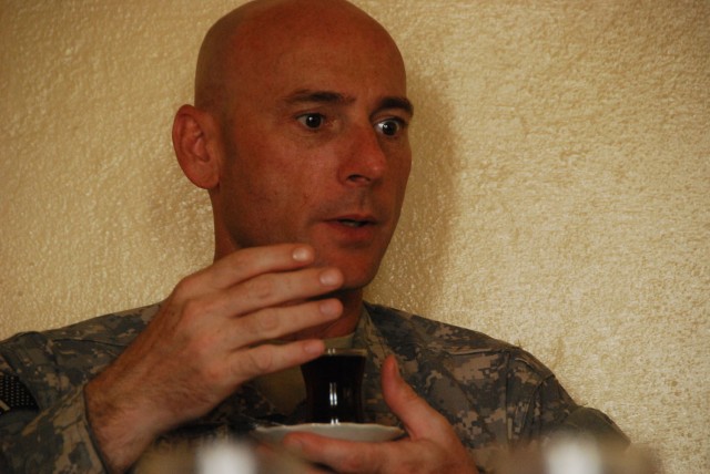TAJI, Iraq- Ozark, Ala. native, Lt. Col. Eric Schwegler, commander of the 1st Battalion, 82nd Field Artillery Regiment, 1st Brigade Combat Team, 1st Cavalry Division, discusses the needs of Sheik Abdullah and his village over tea, Oct. 9....