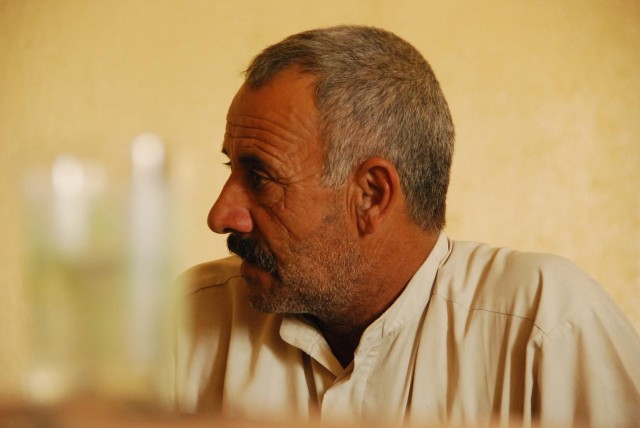 TAJI, Iraq- Sheik Abdullah, a local Sons of Iraq leader, listens during a meeting with Soldiers of the 1st Battalion, 82nd Field Artillery Regiment, 1st Brigade Combat Team, 1st Cavalry Division, Oct. 9. During the visit, Abdullah and the...