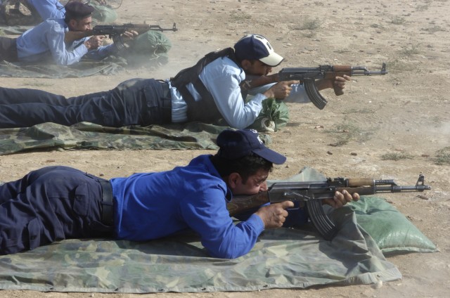 Iraqi Police fire Avtomat Kalashnikova-47 rifles, also known as AK-47s, on the Bagara range held on Forward Operating Base McHenry, on Oct. 8. A total of 278 Iraqi Police Officers, which included 16 officers, fired on this range supported by the...