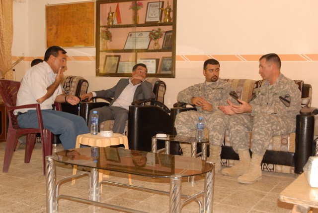 Lt. Col. Hugh McNeely (right), the deputy commanding officer for 2nd Brigade Combat Team, 1st Cavalry Division, listens as Sheikh Ghazi al-Deen Talabani (left) explains the workings of the micro-dairy farm that will soon be constructed on his...