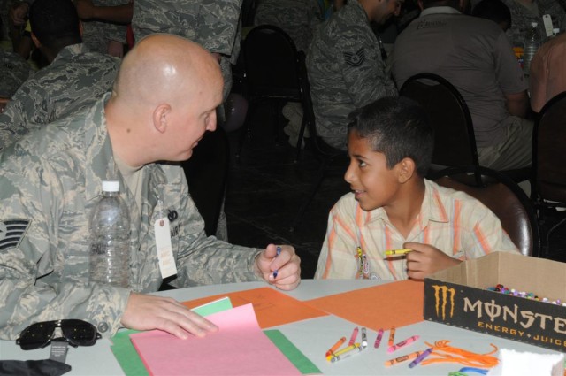 Service members mentor local children