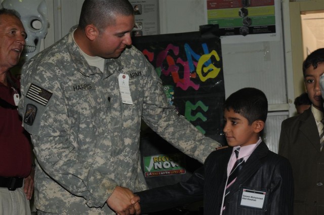 Service members mentor local children