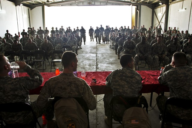 CAMP TAJI, Iraq-During a visit to Camp Taji, Iraq, Oct. 13, servicemembers participating in Operation Proper Exit, talk with Soldiers of the 1st ACB in a town hall forum about injuries they sustained in combat, the recovery process and...