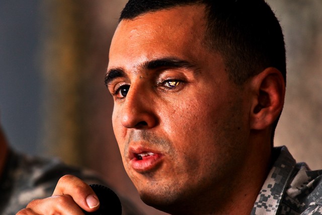 CAMP TAJI, Iraq-Living with partial blindness from a road side bomb, retired Cpl. Graig Chavez talks with Soldiers of the 1st ACB about his recovery process and what has driven him to move forward with his life, during a visit to Camp Taji, Iraq,...
