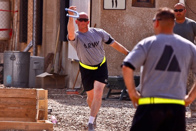 CAMP TAJI, Iraq-During an organizational day, Sgt. 1st Class Thomas Reid, from Killeen, Texas, the first sergeant for Company A, plays a game of horseshoes with fellow Soldiers, Oct.16. Six months into the deployment, the Soldiers spent part of...
