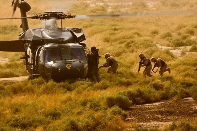 CAMP TAJI, Iraq-Not only did the Soldiers of the 34th Iraqi Army Brigade, 9th IA Division practice aerial insertions from their Iraqi Air Force helicopters, they also honed their skills jumping in and out of a UH-60 Black Hawk helicopter from 3rd Bat...