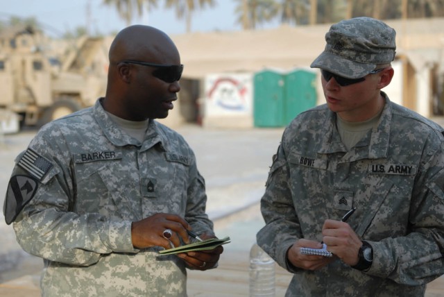 BAGHDAD - Brooklyn, N.Y. native, Staff Sgt. Aussie Barker (left), team chief assigned to Company B, 2nd Battalion, 5th Cavalry Regiment, 1st Brigade Combat Team, 1st Cavalry Division, and Sebring, Fla. Native, Sgt. Jessie Rowe, shop foreman also...