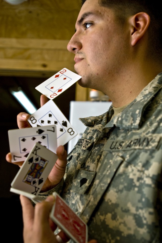 BAGHDAD -"What I love about magic is that you can kind of reach out and touch people with it," said Spc. Jose Barrientos, from San Diego. "You can bend the rules of the universe for just a moment and everybody goes into that place in their mind...