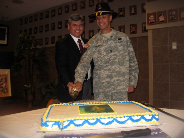 4th BCT, 1st Cav. Div. Command Sgt. Major, Command Sgt. Major Edwin Rodriguez and Command Sgt. Major (retired) Richard Hernandez, cut the ceremonial cake during the. "Long Knife" brigade's Hispanic Heritage Observance at the Operation Iraqi...