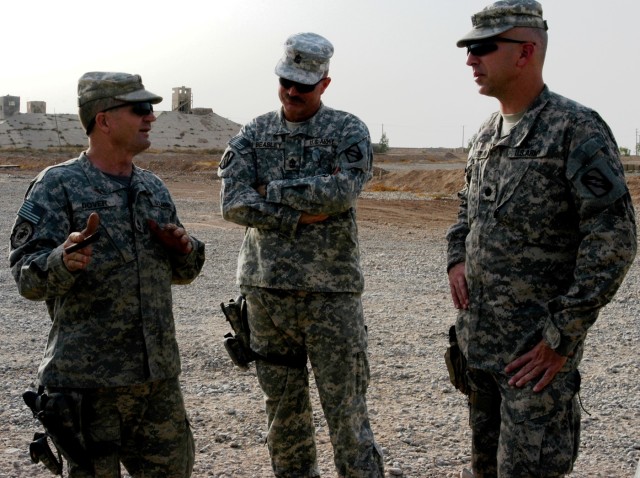 CONTINGENCY OPERATING LOCATION Q-WEST, Iraq - Sgt. 1st Class Randolph Dover (left), a motor sergeant from Sardis, Miss., and 1st Sgt. John L. Beasley (middle), native of Henando, Miss., both of Company A, 2nd Battalion, 198th Combined Arms out of...