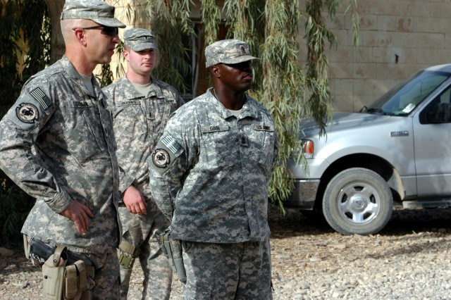 CONTINGENCY OPERATING LOCATION Q-WEST, Iraq - Lt. Col. Kerry Goodman (left), a native of Meridian, Miss., and commander of 2nd Battalion, 198th Combined Arms headquartered in Senatobia, Miss., reviews the motor pool of Company B, 2/198th CAB, out...