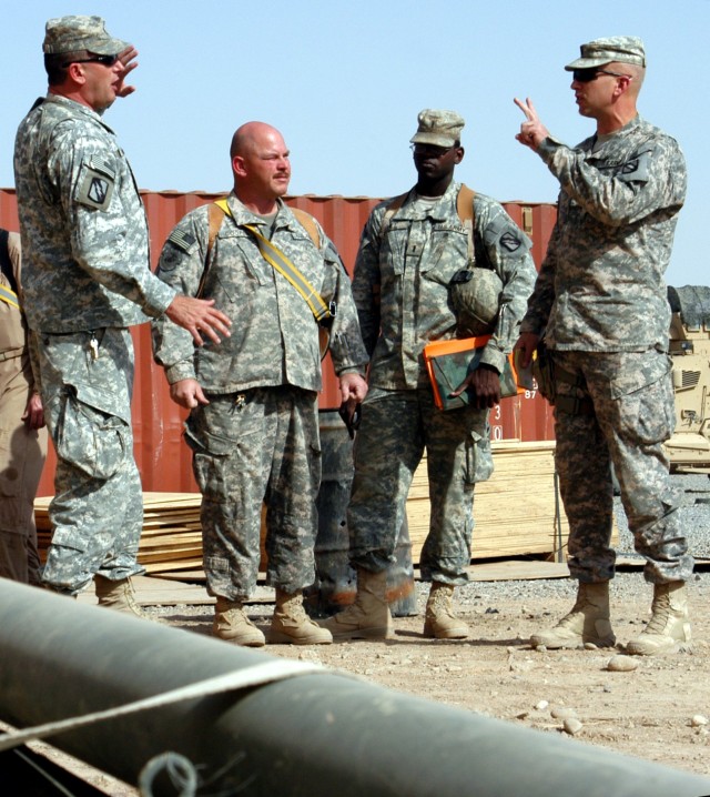 CONTINGENCY OPERATING LOCATION Q-WEST, Iraq - From left to right, 1st Sgt. John Moyer, of  Senatobia, Miss., Sgt. 1st Class Wilton R. Cooper, motor sergeant from Mantachie, Miss, and 1st Lt.  Jesse Hill, Jr., executive officer from Meridian,...
