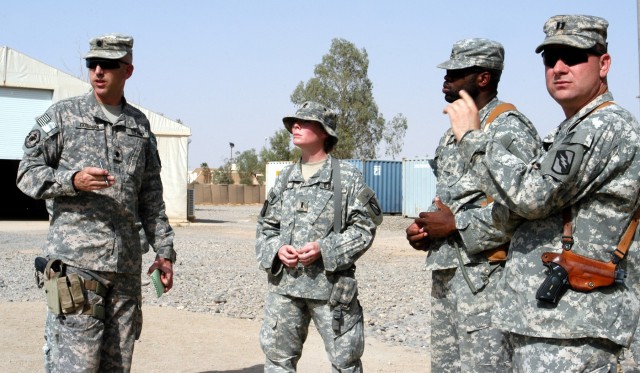 CONTINGENCY OPERATING LOCATION Q-WEST, Iraq - Lt. Col. Kerry Goodman (left), a native of Meridian, Miss., and commander of 2nd Battalion, 198th Combined Arms headquartered in Senatobia, Miss., reviews the motor pool of Company A, 106th Brigade...
