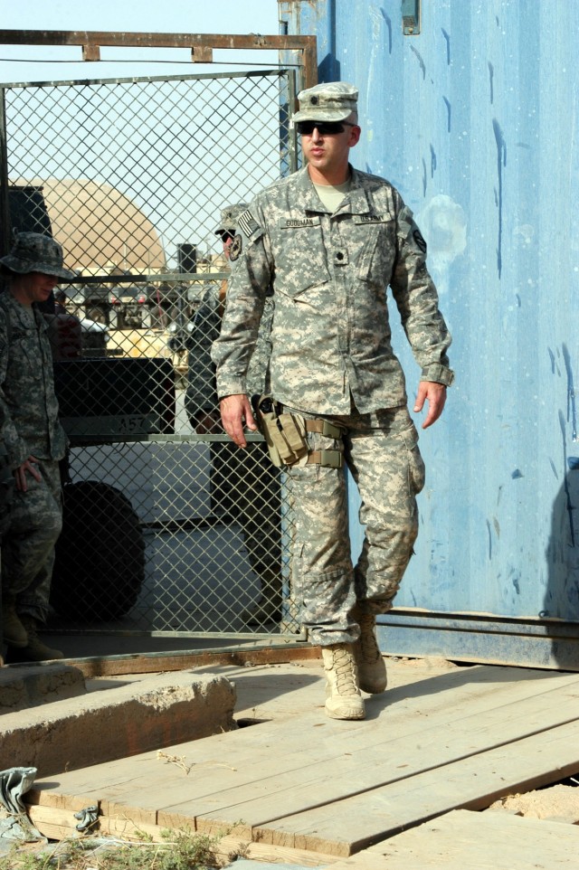 CONTINGENCY OPERATING LOCATION Q-WEST, Iraq - Lt. Col. Kerry Goodman, a native of Meridian, Miss., and commander of 2nd Battalion, 198th Combined Arms headquartered in Senatobia, Miss., inspects the maintenance shop area of Company A, 106th...