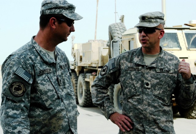 CONTINGENCY OPERATING LOCATION Q-WEST, Iraq - Sgt. 1st Class Bradley Johnson (left), native of Brookhaven, Miss., and motor sergeant for Company A, 106th Brigade Support Battalion (Attached), out of Magee, Miss., listens to guidance from Lt. Col....