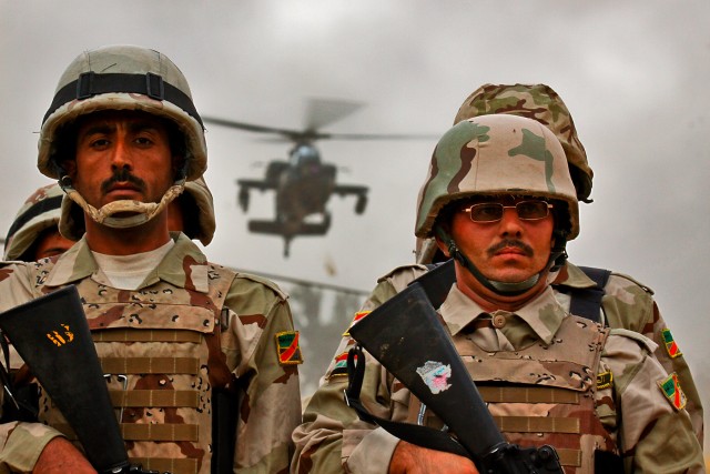 CAMP TAJI, Iraq-A UH-60 Black Hawk helicopter from 3rd Battalion, 1st Air Cavalry Brigade, 1st Cavalry Division, approaches a simulated battlefield during a joint mission between U.S. Army, Iraqi Army and Iraqi Air Force partners, Oct. 22. The...