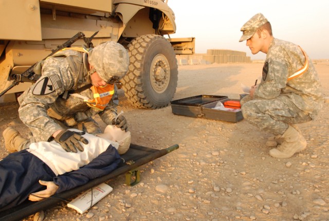 Sgt. Randall Williams, a Round Rock, Texas, native and a convoy commander with 15th Brigade Support Battalion, 2nd Brigade Combat Team, 1st Cavalry Division, inserts a nasopharyngeal into a dummy as part of a first aid test during the...