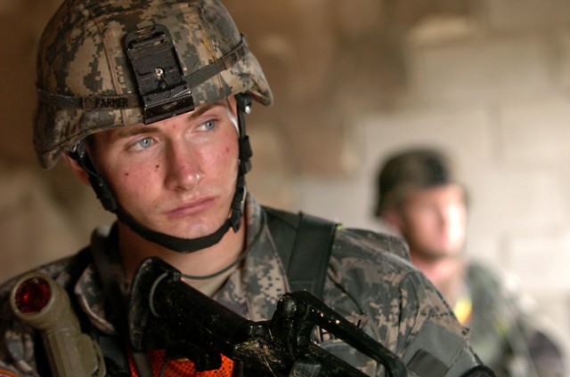 Sgt. William Farmer, a scout assigned to Troop B, 1st Squadron, 9th Cavalry Regiment, 4th BCT, 1st Cav. Div., of Killeen, Texas, watches out for enemy activity as he allows his team to take a much needed break during the Spur Ride's Scout's skills...
