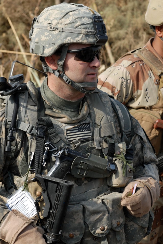 TAJI, Iraq - Killeen, Texas native, 2nd Lt. Robert Coombs, a platoon leader attached to the 1st" Battalion, 82nd Field Artillery Regiment, 1st Brigade Combat Team, 1st Cavalry Division, supervises as Soldiers clear a building during a combined air...