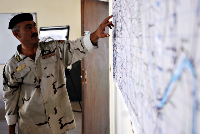 BAGHDAD-Map reading is just one of many skills 9th Iraq Army Division non-commissioned officers taught by their American counterparts of the 9th IA Div. military transition team. The course is taught with the hopes that the participants will take wha...