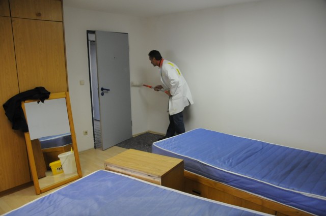 U.S. Army Garrison Hohenfels Department of Public Works employee Frank Obletzhauser prepares a vacated room in the barracks for its new tenant. As part of the First Sergeant's Barracks Initiative, DPW's Housing office will be responsible for all...