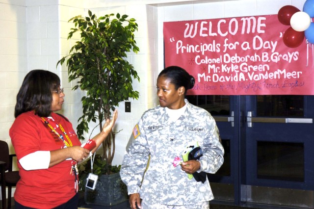 Colonel promoted to principal for day
