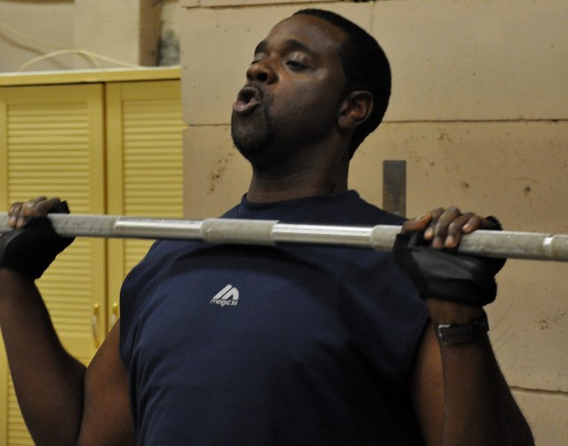 Ken Patterson, a field support engineer for 15th Sustainment Brigade and Baltimore native lifts a barbell during part of a CrossFit training session in the new Headquarters and Headquarters, 15th Special Troops Battalion, 15th Sus. Bde. Crossfit...