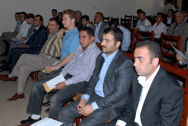 Local businessmen listen to instructions on how to register with the Joint Contracting Command during a conference in Erbil, Iraq, Oct. 27. This was the first conference of its kind held in Erbil, where there are few businesses currently registered w...