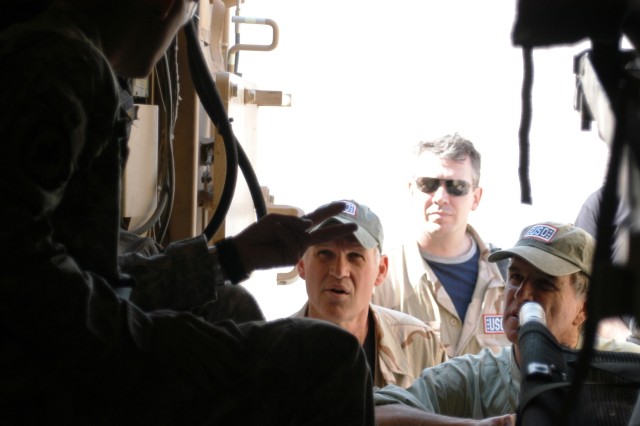 CONTINGENCY OPERATING LOCATION Q-WEST, Iraq - Sgt. Seth A. Bloodworth (left), of Lake Cormorant, Miss., and truck commander with A Company, 2nd Battalion, 198th Combined Arms out of Hernando, Miss., describes the Heavy Armored Ground Ambulance, a med...