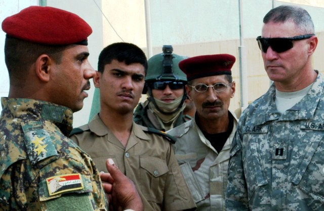 CONTINGENCY OPERATING LOCATION Q-WEST, Iraq - Members of the Mississippi Army National Guard consulted with elements of the Iraqi Army at the Al-Qayyarah pump house Oct. 26. 1st Lt. Salah Joad (left), commander of 1st Company, 2nd Battalion, 26th...