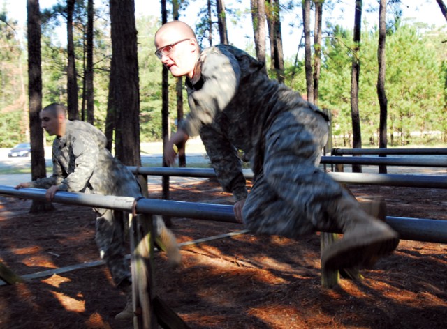 Recruits crawl, climb, swing through training