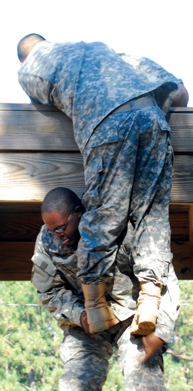 Recruits crawl, climb, swing through training