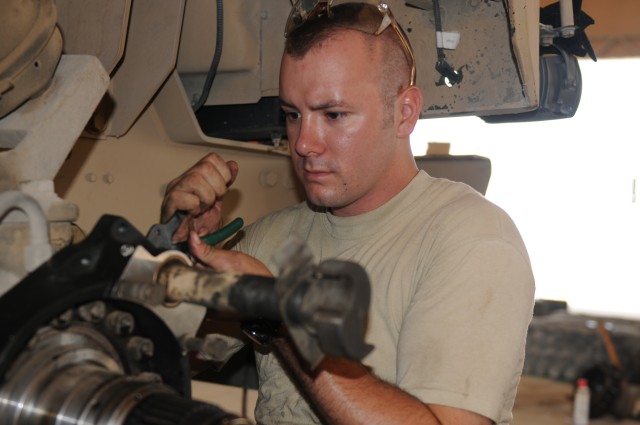 443rd Soldier works on a vehicle at the unit&#039;s machine shop