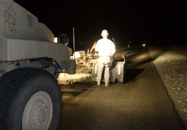 CONTINGENCY OPERATING LOCATION Q-WEST, Iraq - Sgt. Ryan Lee, a scout truck commander from Independence, Miss., and member of 1st Platoon, C Company, 2nd Battalion, 198th Combined Arms out of Oxford, Miss., stands behind the Self-Protection Adaptive R...