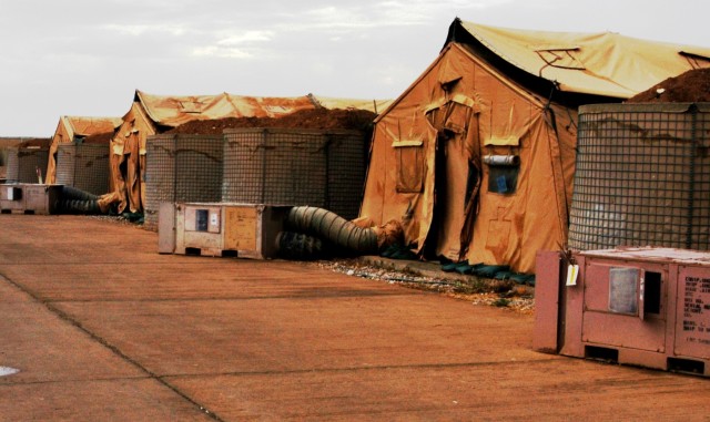 CONTINGENCY OPERATING LOCATION Q-WEST, Iraq - The temporary housing of Forward Operating Base Warrior's Convoy Readiness Center consist of 30-man tents. Members of 1st Platoon, C Company, 2nd Battalion, 198th Combined Arms, a Mississippi Army...