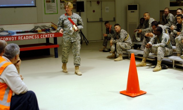 CONTINGENCY OPERATING LOCATION Q-WEST, Iraq - Capt. Amy Noble (standing), chaplain at the Q-West Convoy Readiness Center, shares a devotional message with members of 1st Platoon, C Company, 2nd Battalion, 198th Combined Arms, a Mississippi Army Natio...