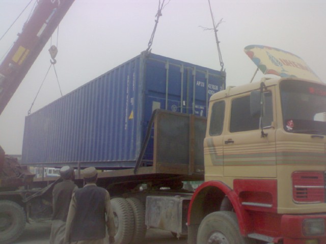 Workers load cargo