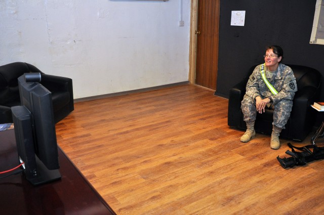 Capt. Diane Boor, a Linwood, Mich., native and 15th Sustainment Brigade physician's assistant speaks with her family at Fort Hood from the 15th Special Troops Battalion, 15th Sust. Bde., headquarters building here Nov. 7, two days after a violent...