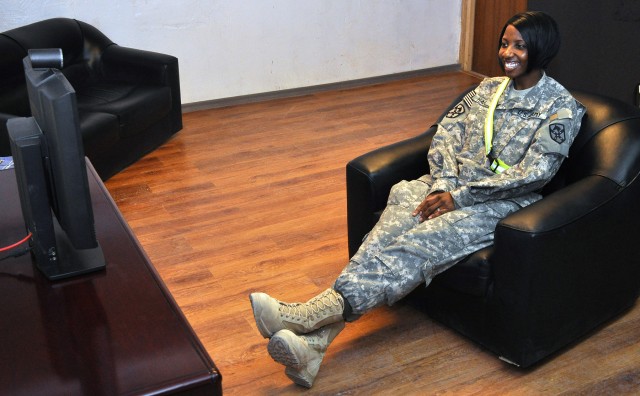 Capt. Nicole Harrell, a 15th Sustainment Brigade support operations planner and Los Angeles, native, speaks with her family at Fort Hood from the 15th Special Troops Battalion, 15th Sust. Bde., headquarters building here Nov. 7, two days after a...